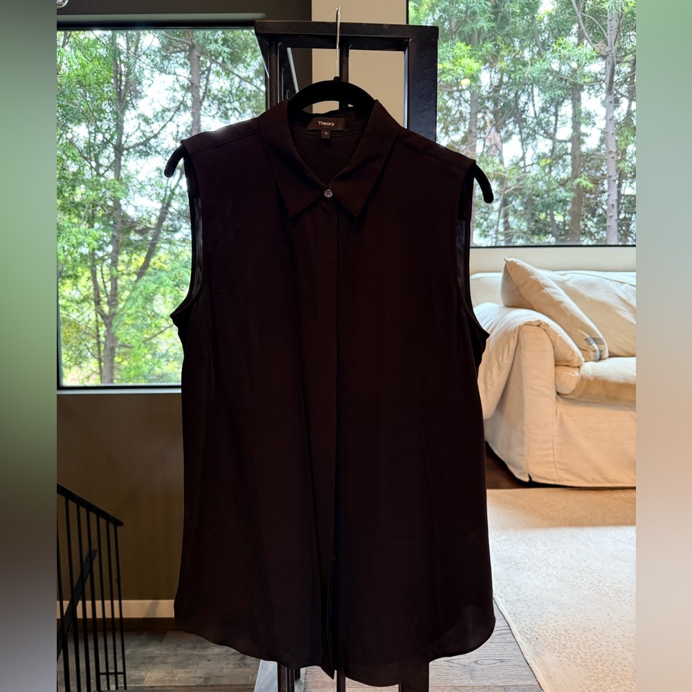Theory black silk sleeveless button down top.